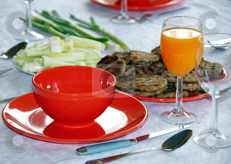 To use this stock image in your creative project, please select the size you need over to the right and click the "Add to Cart" button.
Your downloaded image will come with the Cutcaster watermark removed so don’t worry about the watermark you see on this page. Dinner stock photo, Red plates and orange juice served on table in kitchen by Julija Sapic