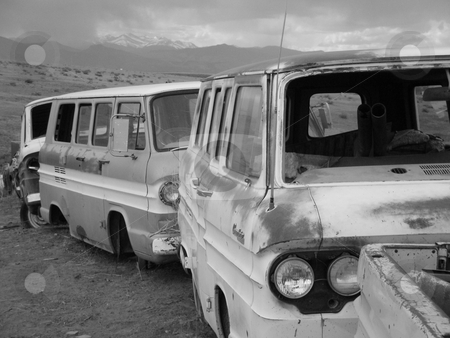 To use this stock image in your creative project, please select the size you need over to the right and click the "Add to Cart" button.
Your downloaded image will come with the Cutcaster watermark removed so don’t worry about the watermark you see on this page. Rocky Mountain Traffic Jam stock photo, Line of junk vans with shadow of the majestic Rocky Mountains in the background. Near Loveland, Colorado. by James Spence
