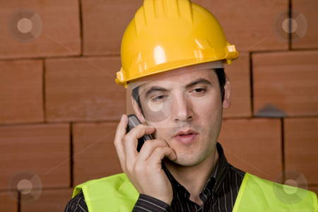 To use this stock image in your creative project, please select the size you need over to the right and click the "Add to Cart" button.
Your downloaded image will come with the Cutcaster watermark removed so don’t worry about the watermark you see on this page. Engineer stock photo, Engineer with yellow hat with a brick wall as background by Rui Vale de Sousa