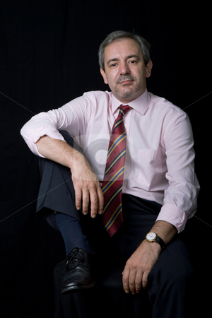 To use this stock image in your creative project, please select the size you need over to the right and click the "Add to Cart" button.
Your downloaded image will come with the Cutcaster watermark removed so don’t worry about the watermark you see on this page. Standing stock photo, Mature business man portrait on black background by Rui Vale de Sousa