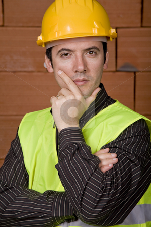 To use this stock image in your creative project, please select the size you need over to the right and click the "Add to Cart" button.
Your downloaded image will come with the Cutcaster watermark removed so don’t worry about the watermark you see on this page. Pensive stock photo, Engineer with yellow hat with a brick wall as background by Rui Vale de Sousa