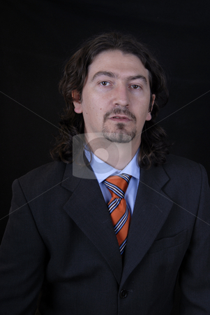 To use this stock image in your creative project, please select the size you need over to the right and click the "Add to Cart" button.
Your downloaded image will come with the Cutcaster watermark removed so don’t worry about the watermark you see on this page. Portrait stock photo, Young business man portrait on black background by Rui Vale de Sousa