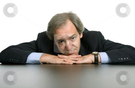To use this stock image in your creative project, please select the size you need over to the right and click the "Add to Cart" button.
Your downloaded image will come with the Cutcaster watermark removed so don’t worry about the watermark you see on this page. Bored stock photo, Mature business man on a desk, isolated on white by Rui Vale de Sousa