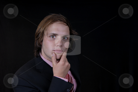 To use this stock image in your creative project, please select the size you need over to the right and click the "Add to Cart" button.
Your downloaded image will come with the Cutcaster watermark removed so don’t worry about the watermark you see on this page. Young stock photo, Young business man portrait on black background by Rui Vale de Sousa