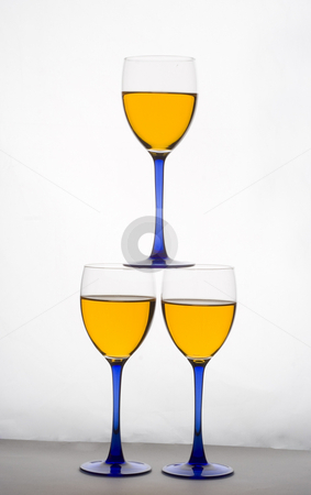 To use this stock image in your creative project, please select the size you need over to the right and click the "Add to Cart" button.
Your downloaded image will come with the Cutcaster watermark removed so don’t worry about the watermark you see on this page. Stacked wine glasses stock photo, Three wine glasses stacked on top of each other by Matt Baker