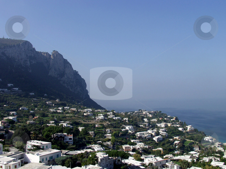 To use this stock image in your creative project, please select the size you need over to the right and click the "Add to Cart" button.
Your downloaded image will come with the Cutcaster watermark removed so don’t worry about the watermark you see on this page. Town by the sea stock photo, A small town sits between a cliff and the sea by Matt Baker