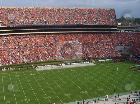 To use this stock image in your creative project, please select the size you need over to the right and click the "Add to Cart" button.
Your downloaded image will come with the Cutcaster watermark removed so don’t worry about the watermark you see on this page. College football game stock photo, A packed stadium for a college football game by Matt Baker