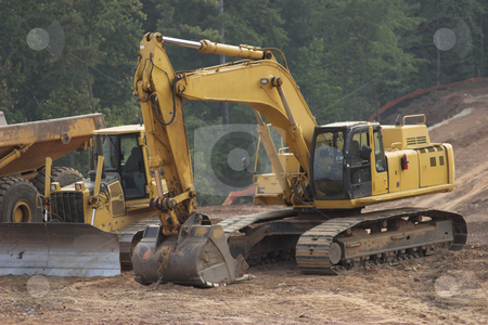 To use this stock image in your creative project, please select the size you need over to the right and click the "Add to Cart" button.
Your downloaded image will come with the Cutcaster watermark removed so don’t worry about the watermark you see on this page. Construction stock photo, Construction equipment excavating land by Matt Baker