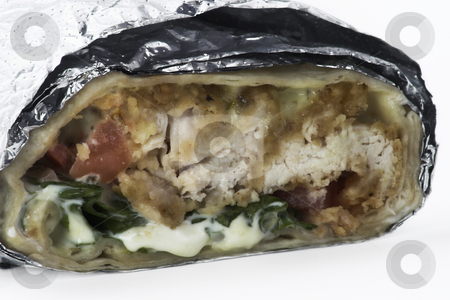 To use this stock image in your creative project, please select the size you need over to the right and click the "Add to Cart" button.
Your downloaded image will come with the Cutcaster watermark removed so don’t worry about the watermark you see on this page. Chicken Tender Sandwich Wrap stock photo, Chicken tenders made into a sandwich wrap by Matt Baker