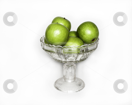 To use this stock image in your creative project, please select the size you need over to the right and click the "Add to Cart" button.
Your downloaded image will come with the Cutcaster watermark removed so don’t worry about the watermark you see on this page. Bowl of apples stock photo, A crystal bowl sits full of apples by Matt Baker