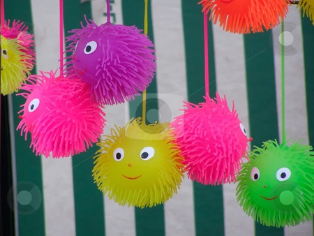 To use this stock image in your creative project, please select the size you need over to the right and click the "Add to Cart" button.
Your downloaded image will come with the Cutcaster watermark removed so don’t worry about the watermark you see on this page. Happy toys stock photo, Line of colored toys by Sergej Razvodovskij