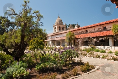 To use this stock image in your creative project, please select the size you need over to the right and click the "Add to Cart" button.
Your downloaded image will come with the Cutcaster watermark removed so don’t worry about the watermark you see on this page. Mission San Carlos Borromeo de Carmelo stock photo, Mission San Carlos Borromeo de Carmelo, also known as the Carmel Mission, is a historic Roman Catholic mission church in Carmel-by-the-Sea, California. It was the headquarters of the padre presidente, Father Fermin Francisco de Lasuen. by Mariusz Jurgielewicz