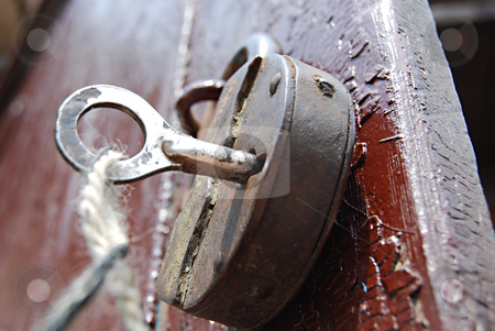 To use this stock image in your creative project, please select the size you need over to the right and click the "Add to Cart" button.
Your downloaded image will come with the Cutcaster watermark removed so don’t worry about the watermark you see on this page. Old lock stock photo, Iron key stuck in the old rusty lock by Leyla Akhundova