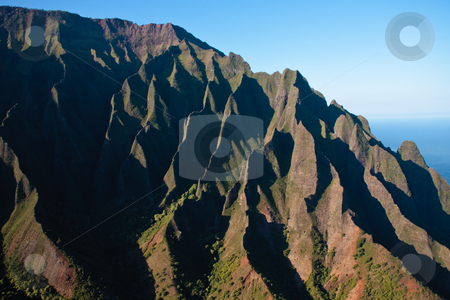To use this stock image in your creative project, please select the size you need over to the right and click the "Add to Cart" button.
Your downloaded image will come with the Cutcaster watermark removed so don’t worry about the watermark you see on this page. Wrinkled cliff face on Na Pali coast in Kauai stock photo, Close up of the rock face on the Na Pali coast on the north of Kauai by Steven Heap