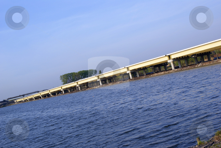 To use this stock image in your creative project, please select the size you need over to the right and click the "Add to Cart" button.
Your downloaded image will come with the Cutcaster watermark removed so don’t worry about the watermark you see on this page. Flyover stock photo, New closed flyover built near the water by Jolanta Dabrowska