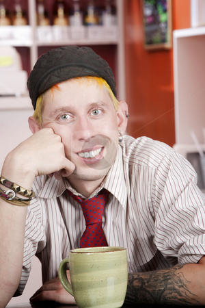 To use this stock image in your creative project, please select the size you need over to the right and click the "Add to Cart" button.
Your downloaded image will come with the Cutcaster watermark removed so don’t worry about the watermark you see on this page. Hipster in a Coffee House stock photo, Portrait of handsome young hipster in a coffee house by Scott Griessel