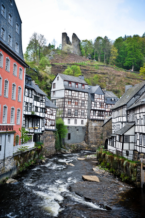 To use this stock image in your creative project, please select the size you need over to the right and click the "Add to Cart" button.
Your downloaded image will come with the Cutcaster watermark removed so don’t worry about the watermark you see on this page. Monschau Germany stock photo, Houses and river in Monschau Germany by Jaime Pharr