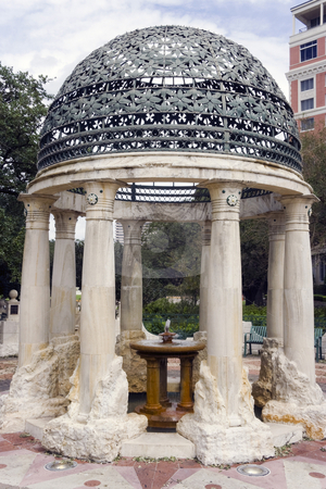 To use this stock image in your creative project, please select the size you need over to the right and click the "Add to Cart" button.
Your downloaded image will come with the Cutcaster watermark removed so don’t worry about the watermark you see on this page. Gazebo Fountain stock photo, A old classical gazebo with a small fountain by Kevin Tietz