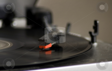 To use this stock image in your creative project, please select the size you need over to the right and click the "Add to Cart" button.
Your downloaded image will come with the Cutcaster watermark removed so don’t worry about the watermark you see on this page. Turntable stock photo, Closeup of a turntable playing a vinyl record by Fabio Alcini