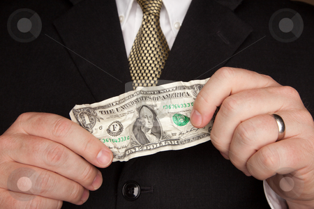 To use this stock image in your creative project, please select the size you need over to the right and click the "Add to Cart" button.
Your downloaded image will come with the Cutcaster watermark removed so don’t worry about the watermark you see on this page. Businessman Holding Wrinkled Dollar Bill stock photo, Businessman with Coat and Tie Holding Wrinkled United States Dollar Bill. by Andy Dean