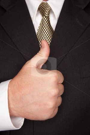 To use this stock image in your creative project, please select the size you need over to the right and click the "Add to Cart" button.
Your downloaded image will come with the Cutcaster watermark removed so don’t worry about the watermark you see on this page. Businessman Gesturing Thumbs Up with Hand stock photo, Businessman with Coat and Tie Gesturing Thumbs Up with Hand. by Andy Dean
