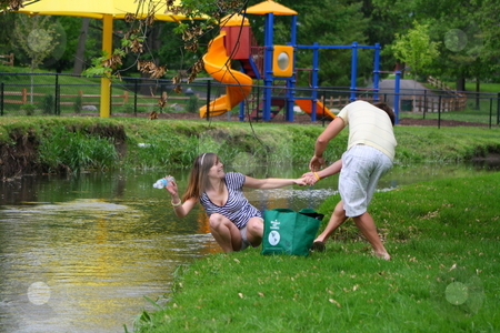 To use this stock image in your creative project, please select the size you need over to the right and click the "Add to Cart" button.
Your downloaded image will come with the Cutcaster watermark removed so don’t worry about the watermark you see on this page. Couple cleaning up the park stock photo, Couple showing how it can be fun to clean up a park together. by Chris Torres