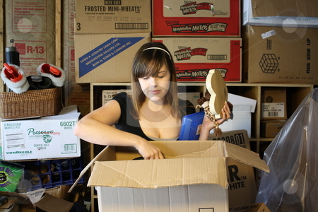 To use this stock image in your creative project, please select the size you need over to the right and click the "Add to Cart" button.
Your downloaded image will come with the Cutcaster watermark removed so don’t worry about the watermark you see on this page. Girl surrounded by boxes stock photo, A girl getting overwhelmed with sorting through boxes. by Chris Torres