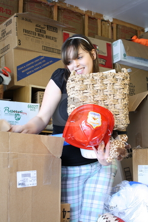To use this stock image in your creative project, please select the size you need over to the right and click the "Add to Cart" button.
Your downloaded image will come with the Cutcaster watermark removed so don’t worry about the watermark you see on this page. Girl surrounded by boxes stock photo, A girl surrounded with boxes trying to sort through the items. by Chris Torres