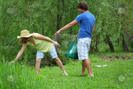 To use this stock image in your creative project, please select the size you need over to the right and click the "Add to Cart" button.
Your downloaded image will come with the Cutcaster watermark removed so don’t worry about the watermark you see on this page. Couple cleaning up the park stock photo, Couple showing how it can be fun to clean up a park together. by Chris Torres