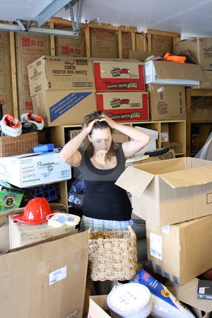 To use this stock image in your creative project, please select the size you need over to the right and click the "Add to Cart" button.
Your downloaded image will come with the Cutcaster watermark removed so don’t worry about the watermark you see on this page. Girl overwhelmed in boxes stock photo, A girl gets overwhelmed in boxes and clutter by Chris Torres
