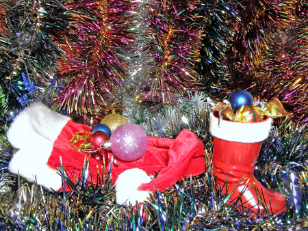 To use this stock image in your creative project, please select the size you need over to the right and click the "Add to Cart" button.
Your downloaded image will come with the Cutcaster watermark removed so don’t worry about the watermark you see on this page. Christmas decoration and cup stock photo, A lot of multicolored decorations and sweets in Christmas boot by Sergej Razvodovskij