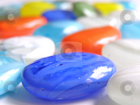 To use this stock image in your creative project, please select the size you need over to the right and click the "Add to Cart" button.
Your downloaded image will come with the Cutcaster watermark removed so don’t worry about the watermark you see on this page. Pebbles stock photo, Multicolored sweet pebbles scattered on the ta by Sergej Razvodovskij