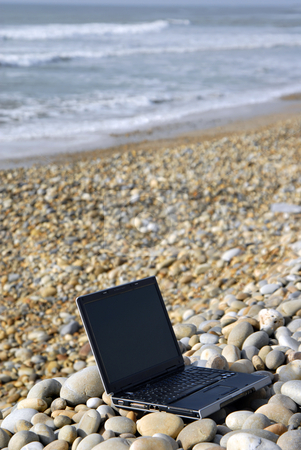 To use this stock image in your creative project, please select the size you need over to the right and click the "Add to Cart" button.
Your downloaded image will come with the Cutcaster watermark removed so don’t worry about the watermark you see on this page. Laptop stock photo, Modern black laptop at the beach rocks by Rui Vale de Sousa