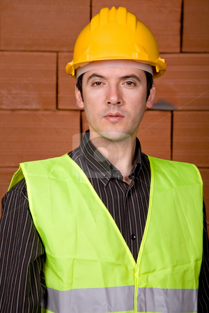 To use this stock image in your creative project, please select the size you need over to the right and click the "Add to Cart" button.
Your downloaded image will come with the Cutcaster watermark removed so don’t worry about the watermark you see on this page. Engineer stock photo, Engineer with yellow hat with a brick wall as background by Rui Vale de Sousa