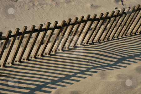 To use this stock image in your creative project, please select the size you need over to the right and click the "Add to Cart" button.
Your downloaded image will come with the Cutcaster watermark removed so don’t worry about the watermark you see on this page. Fence stock photo, Fence on the sand by Rui Vale de Sousa