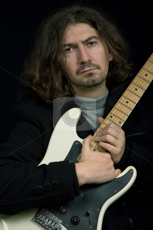 To use this stock image in your creative project, please select the size you need over to the right and click the "Add to Cart" button.
Your downloaded image will come with the Cutcaster watermark removed so don’t worry about the watermark you see on this page. Rocker stock photo, Young rocker in studio picture, closeup portrait by Rui Vale de Sousa