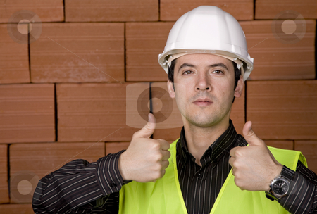 To use this stock image in your creative project, please select the size you need over to the right and click the "Add to Cart" button.
Your downloaded image will come with the Cutcaster watermark removed so don’t worry about the watermark you see on this page. Engineer stock photo, Engineer with white hat and a brick wall as background by Rui Vale de Sousa