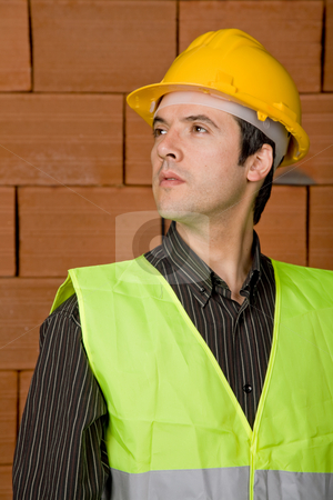 To use this stock image in your creative project, please select the size you need over to the right and click the "Add to Cart" button.
Your downloaded image will come with the Cutcaster watermark removed so don’t worry about the watermark you see on this page. Engineer stock photo, Engineer with yellow hat with a brick wall as background by Rui Vale de Sousa