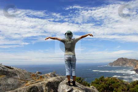 To use this stock image in your creative project, please select the size you need over to the right and click the "Add to Cart" button.
Your downloaded image will come with the Cutcaster watermark removed so don’t worry about the watermark you see on this page. Wide open stock photo, Woman with arms wide open at the coast by Rui Vale de Sousa