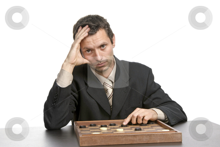 To use this stock image in your creative project, please select the size you need over to the right and click the "Add to Cart" button.
Your downloaded image will come with the Cutcaster watermark removed so don’t worry about the watermark you see on this page. Thinking stock photo, Young man prepares to play a game isolated on white by Rui Vale de Sousa