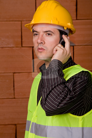 To use this stock image in your creative project, please select the size you need over to the right and click the "Add to Cart" button.
Your downloaded image will come with the Cutcaster watermark removed so don’t worry about the watermark you see on this page. Engineer stock photo, Engineer with yellow hat with a brick wall as background by Rui Vale de Sousa