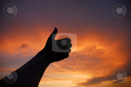 To use this stock image in your creative project, please select the size you need over to the right and click the "Add to Cart" button.
Your downloaded image will come with the Cutcaster watermark removed so don’t worry about the watermark you see on this page. Thumbs up stock photo, Thumbs up human hand in the sunset colors by Rui Vale de Sousa