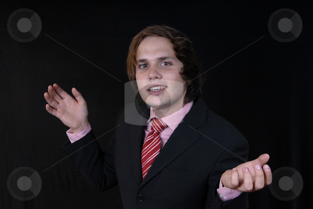 To use this stock image in your creative project, please select the size you need over to the right and click the "Add to Cart" button.
Your downloaded image will come with the Cutcaster watermark removed so don’t worry about the watermark you see on this page. Hands stock photo, Young business man portrait on black background by Rui Vale de Sousa