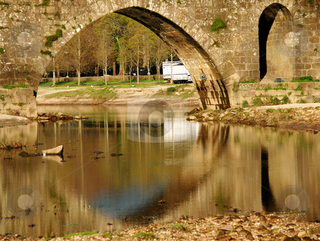 To use this stock image in your creative project, please select the size you need over to the right and click the "Add to Cart" button.
Your downloaded image will come with the Cutcaster watermark removed so don’t worry about the watermark you see on this page. Bridge stock photo, Ancient bridge details by Rui Vale de Sousa
