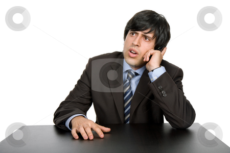 To use this stock image in your creative project, please select the size you need over to the right and click the "Add to Cart" button.
Your downloaded image will come with the Cutcaster watermark removed so don’t worry about the watermark you see on this page. Working stock photo, Young business man on a desk, isolated on white by Rui Vale de Sousa