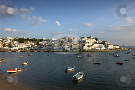 To use this stock image in your creative project, please select the size you need over to the right and click the "Add to Cart" button.
Your downloaded image will come with the Cutcaster watermark removed so don’t worry about the watermark you see on this page. Ferragudo stock photo, Small town of Ferragudo in the south of Portugal by Rui Vale de Sousa