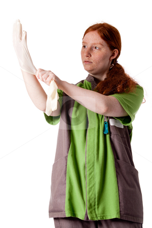 To use this stock image in your creative project, please select the size you need over to the right and click the "Add to Cart" button.
Your downloaded image will come with the Cutcaster watermark removed so don’t worry about the watermark you see on this page. Red haired health care taker putting on her gloves stock photo, Studio shot of health caretaker putting on her gloves. by Frenk and Danielle Kaufmann