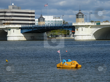 To use this stock image in your creative project, please select the size you need over to the right and click the "Add to Cart" button.
Your downloaded image will come with the Cutcaster watermark removed so don’t worry about the watermark you see on this page. Empty Paddle Boat stock photo, Empty Paddle Boat in the Maumee River with Toledo Ohio's Martin Luther King Bridge in the background. (aka Cherry Street Bridge). by Dazz Lee Photography