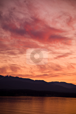 To use this stock image in your creative project, please select the size you need over to the right and click the "Add to Cart" button.
Your downloaded image will come with the Cutcaster watermark removed so don’t worry about the watermark you see on this page. Strait of Juan de Fuca Sunset stock photo, A beautiful sunset over the Strait of Juan de Fuca in Sequim, Washington. by Travis Manley