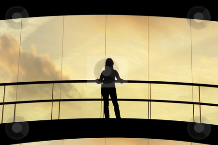 To use this stock image in your creative project, please select the size you need over to the right and click the "Add to Cart" button.
Your downloaded image will come with the Cutcaster watermark removed so don’t worry about the watermark you see on this page. Woman stock photo, Woman in the modern building at sunset by Rui Vale de Sousa